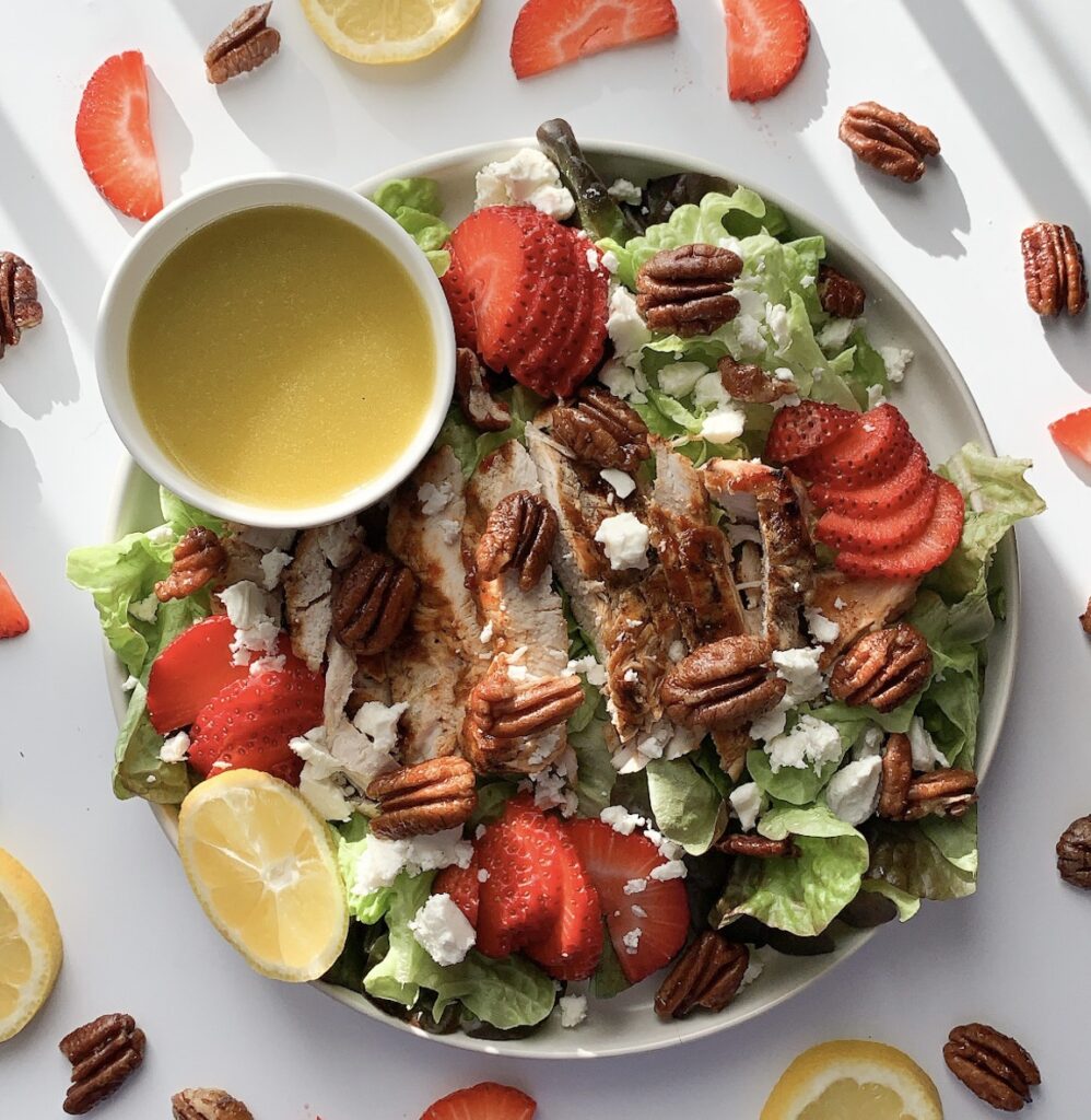 This hearty gluten-free salad features grilled chicken, butter lettuce, sliced strawberries, feta cheese and toasted pecans. Topped with lemon vinaigrette it is perfect for lunch or dinner.