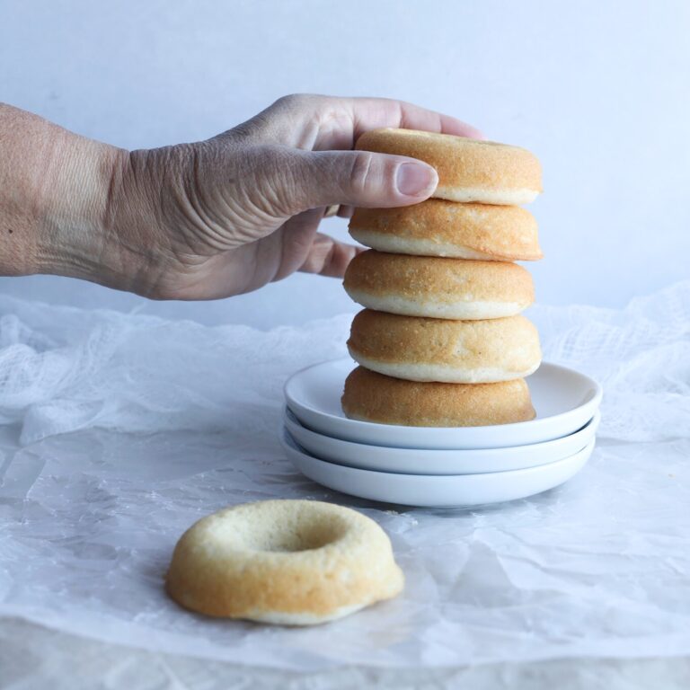 Delicious and moist gluten-free baked donuts that are easy to make and uses simple ingredients. Bring the donut shop home with these baked gluten-free donuts.