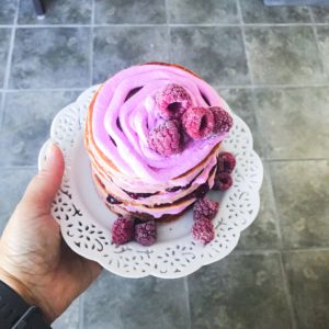 These easy to make gluten-free and paleo pink pancakes are a fun breakfast to make for the kids on the weekend. Uses gluten-free paleo flour, coconut cream and pink pataya powder to color the pancakes pink.