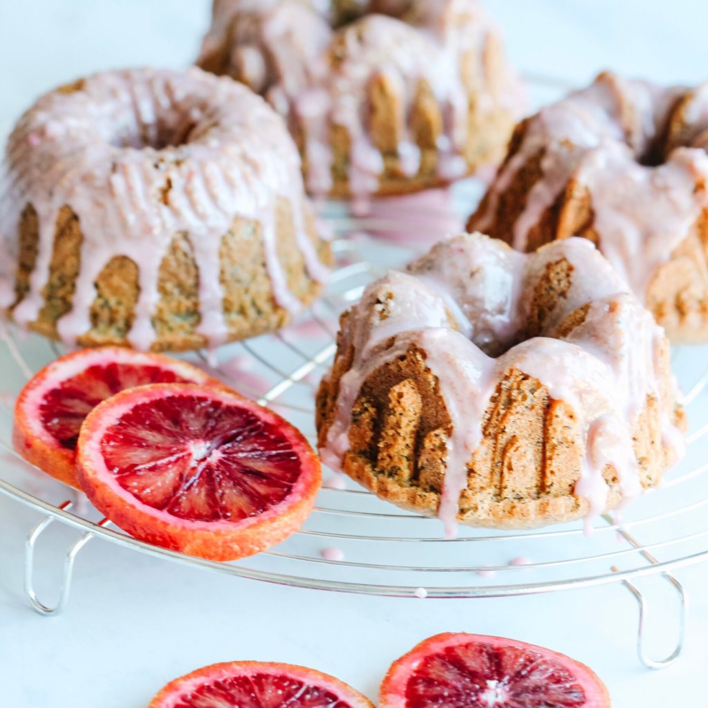 These easy to make gluten-free bundt cakes are moist, dotted with poppyseeds and loaded with fresh blood orange flavour.