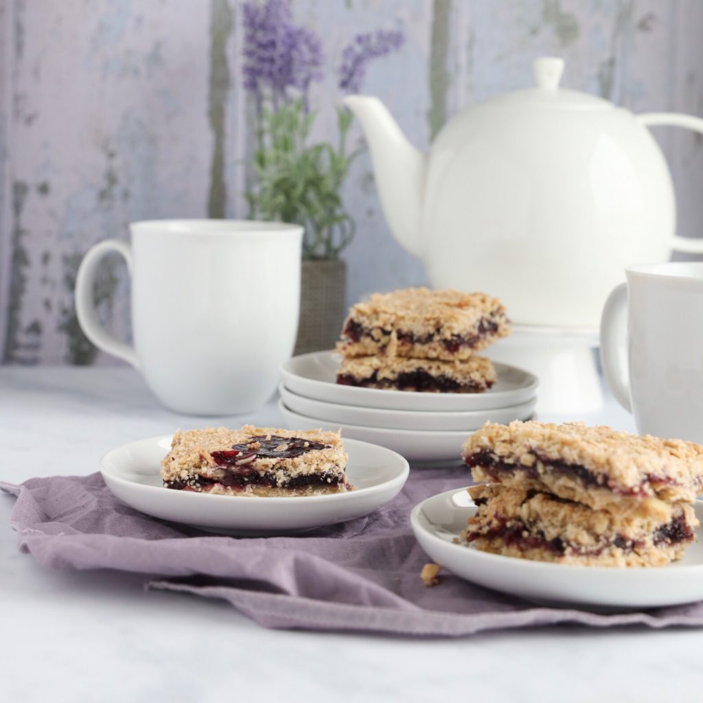 These gluten-free blueberry crumb bars are made with blueberry jam and a buttery crust and crumbly topping.