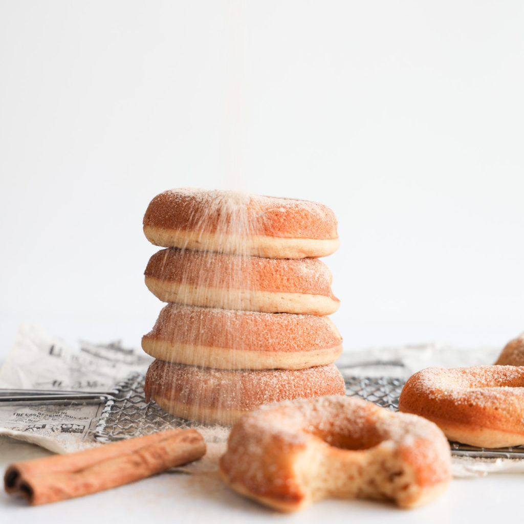 These homemade gluten-free baked donuts are soft and cakey and are dusted with a cinnamon sugar coating.