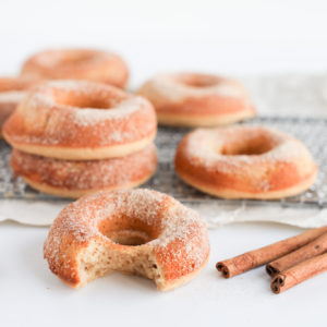 These homemade gluten-free baked donuts are soft and cakey and dusted with a cinnamon sugar coating.