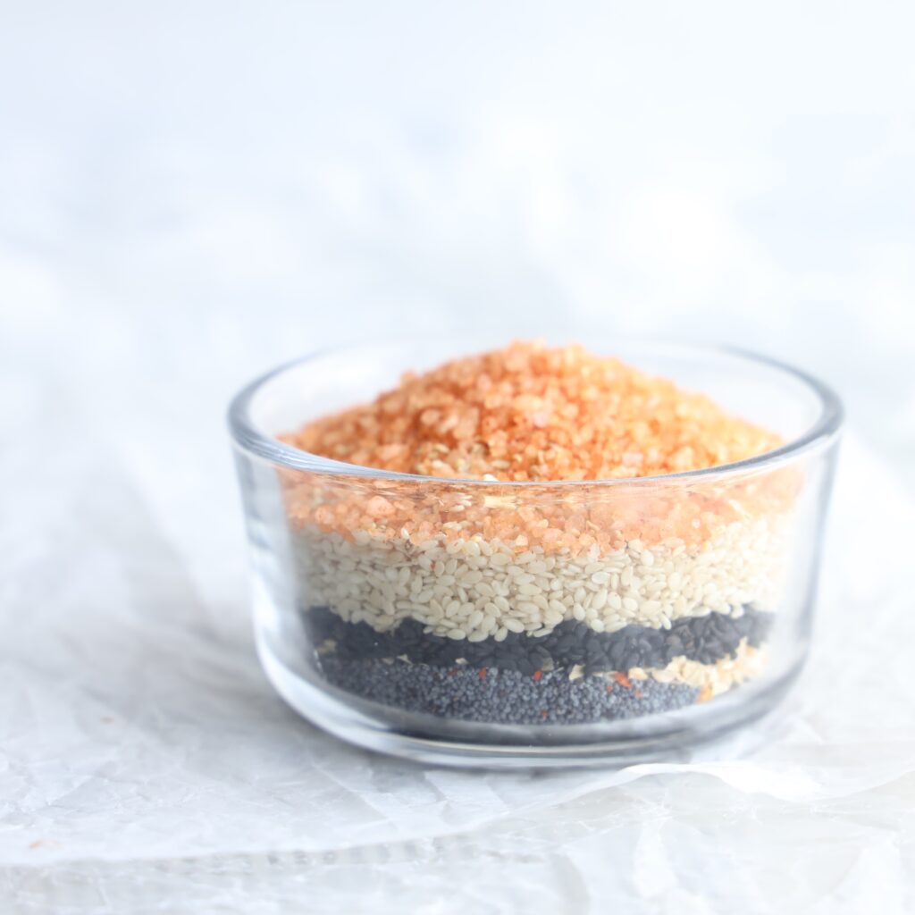 Simple to make and only uses 7 ingredients this gluten-free everything bagel seasoning will become your favorite. It is salty, crunchy, nutty and spicy. Perfect on bagels, bread and crackers.