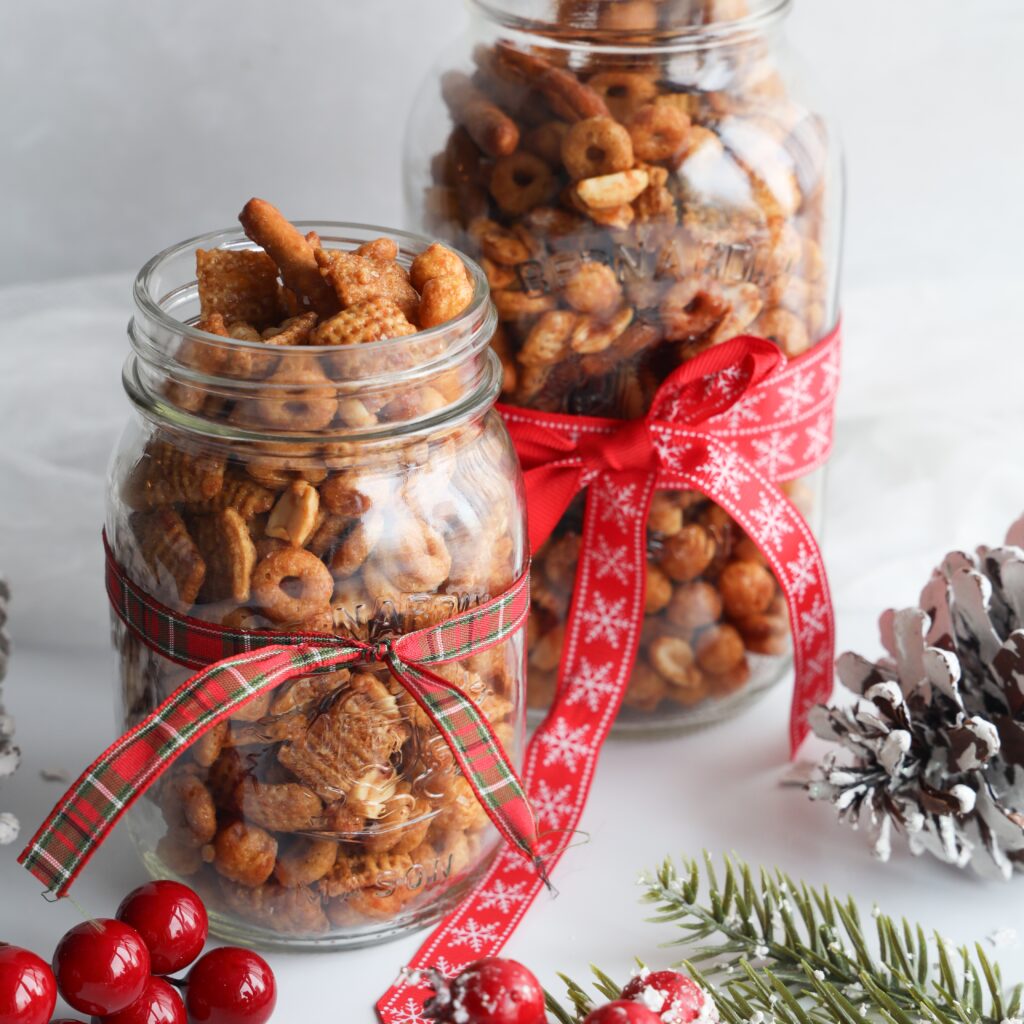 Gluten-free caramel Chex mix is a great holiday snack or food gift that is easy to make. It is so addicting and you will have a hard time only taking one handful to eat. Made with simple ingredients like gluten-free cereals, pretzels and peanuts and the whole recipe can be made in under 40 minutes. 