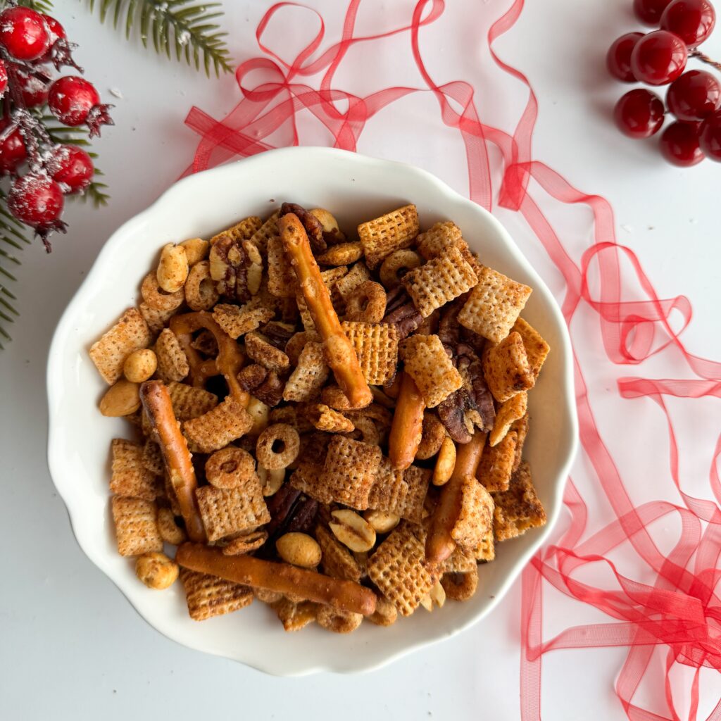 This gluten-free spicy Chex mix is perfect for holiday snacking or as a food gift for Christmas. It is easy to make, crunchy, salty, spicy and delicous. Made with simple ingredients and is a great party appetizer, game night snack with friends or to give as a food gift.