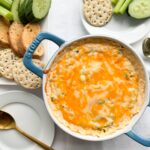 This easy to make, delicious baked crab dip is the perfect hot gluten-free appetizer. Whether you are entertaining family or friends everyone will love. Made with simple ingredients like canned carb, cream cheese, mayo, old bay seasoning, hot sauce and jalapenos. It is the perfect party appetizer whether during the holidays or New Years Eve.
