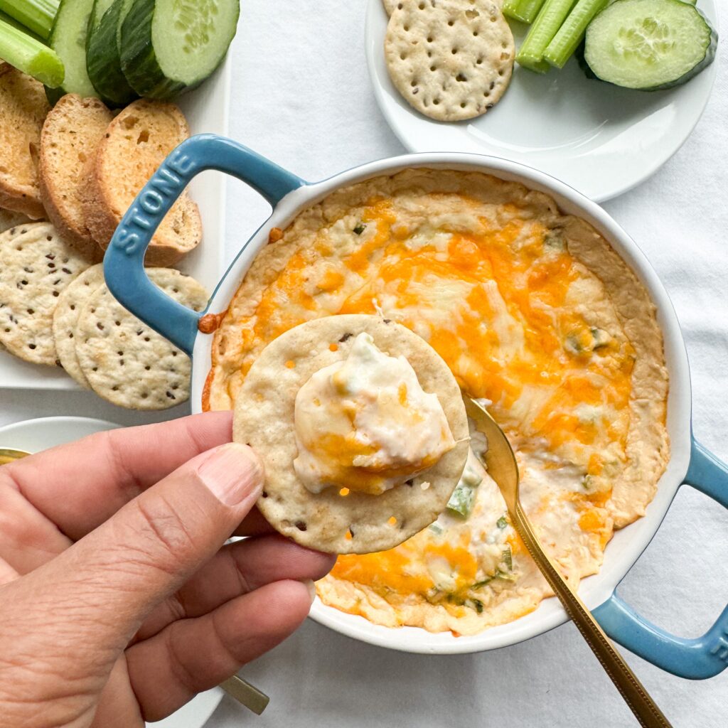 This easy to make, delicious baked crab dip is the perfect hot gluten-free appetizer. Whether you are entertaining family or friends everyone will love. Made with simple ingredients like canned carb, cream cheese, mayo, old bay seasoning, hot sauce and jalapenos. It is the perfect party appetizer whether during the holidays or New Years Eve.