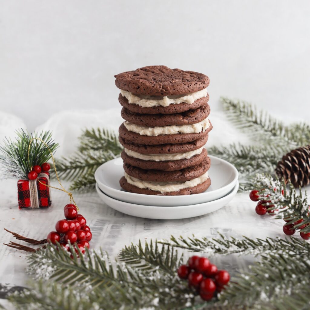 Gluten-free homemade Oreo cookies are easy to make, delicious and perfect anytime of the year. A kid friendly recipe. Fudgy gluten-free cookies stuffed with a creamy filling. Add these gluten-free Oreo cookies to your Christmas baking list and share them with friends and family as a food gift in cookie tins.